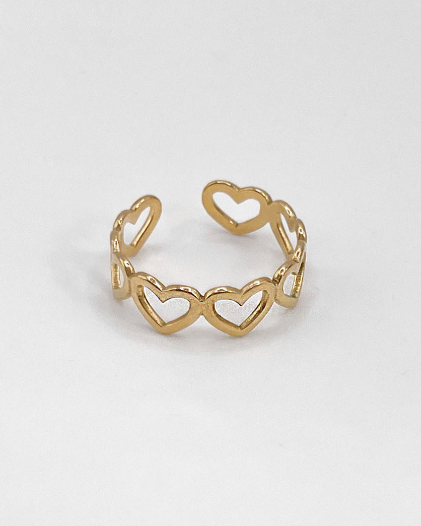 Wasserfester Edelstahlring, verstellbar mit aneinandergereihten Herzen in gold.